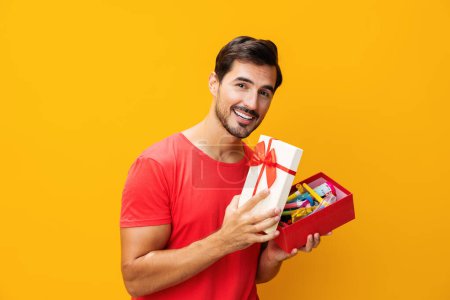 Photo for Christmas man gift holiday model celebrate give celebration happy gift space birthday holding sale box present box studio guy surprise copy male valentine - Royalty Free Image
