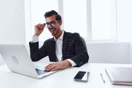 Photo for Internet man working technology winner laptop desk suit office looking emotion computer job business lifestyle victory expression young successful businessman table celebration happy - Royalty Free Image