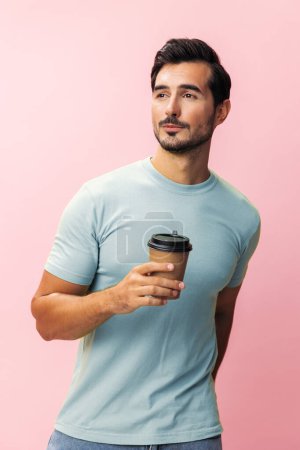 Photo for Man cup fashion paper energy tea space copy sleep drink student coffee pink hot hipster t-shirt happy smile studio isolated mug - Royalty Free Image