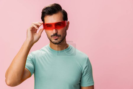 Photo for Fashion man glasses smile looking colourful trendy model eyeglass handsome isolated sunglasses background style guy happy portrait studio dance lifestyle attractive cheerful party - Royalty Free Image