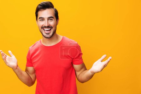 Photo for Man isolated portrait trendy space model guy background laughing confident yellow attractive style lifestyle smiling smile business cheerful arm copy gesture fashion studio - Royalty Free Image