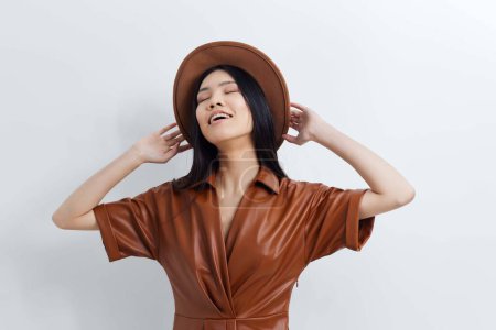 Photo for Happy woman portrait cosmetic cute femininity glamour hair beautiful hair elegance black attractive long fashion face girl model hair hat beige beauty asian salon - Royalty Free Image