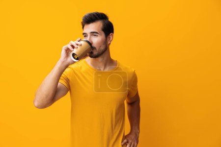 Photo for Man paper hot background tea copy drink coffee cup fashion isolated student hipster space pink smile energy t-shirt mug studio sleep insomnia happy - Royalty Free Image