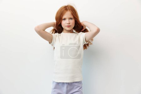 Photo for Beauty cute portrait young childhood small kid person female face caucasian pretty model background children adorable girl little gesture white emotion expression - Royalty Free Image
