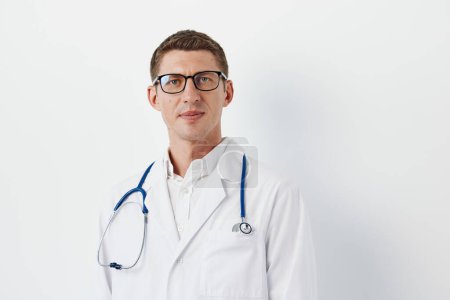 Photo for Caucasian clinic confidence men portrait background person stethoscope medic professional physician doctor hospital handsome health men adult medicine care white - Royalty Free Image