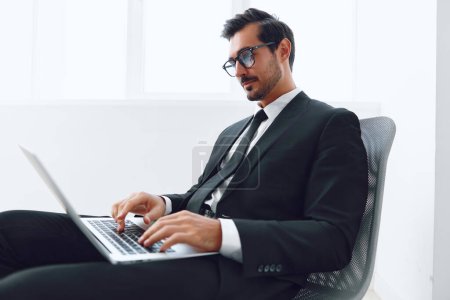 Photo for Person man chair celebration office job technology laptop success happy winner caucasian corporate professional business businessman looking sitting white internet occupation - Royalty Free Image