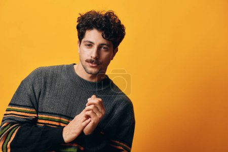 Photo for Man handsome white background attire fashion natural happy portrait cool emotion adult hispanic cheerful serious casual trendy young head smile student expression orange attractive sweater winter - Royalty Free Image