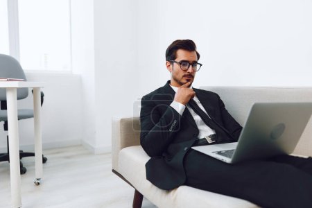 Photo for Man business couch handsome home video watching looking millennial person room young networking sofa laptop happy call male smiling internet portrait successful online - Royalty Free Image
