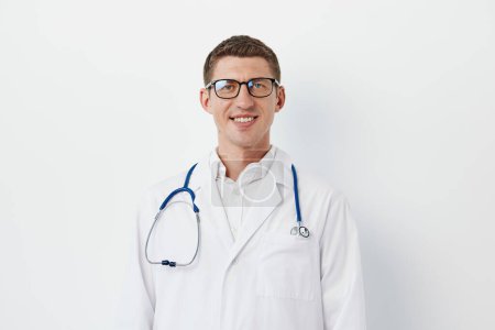 Photo for Uniform men practitioner medic white confidence portrait medicine background physician doctor health healthcare clinical professional care hospital adult men stethoscope young occupation person - Royalty Free Image
