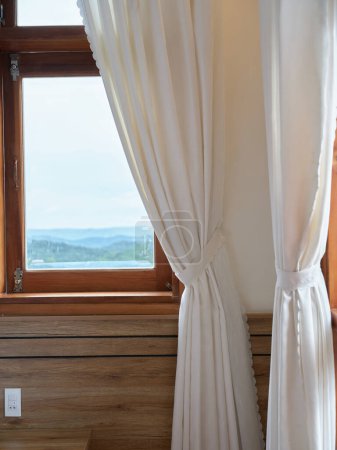 Photo for Old window with wooden frame and light curtain in traditional house style with beautiful view. High quality photo - Royalty Free Image