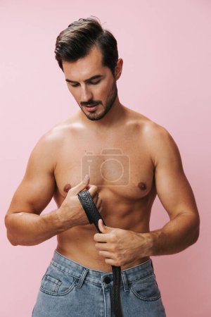 Photo for Muscular man beauty bicep muscle shirtless naked background pink model sport fit fitness strong belt jeans lifestyle sexy body fashion holiday torso - Royalty Free Image
