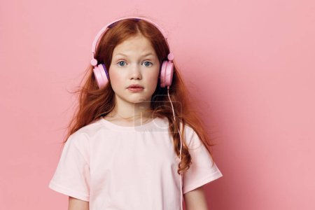 Photo for Enjoy musical wireless headset tune girl kid stereo young audio childhood little headphones sound listen earphones cute children entertainment song technology beauty small - Royalty Free Image