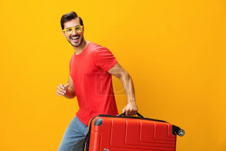 Photo for Weekend man background yellow suitcase space trip journey baggage guy vacation copy holiday hipster travel yellow lifestyle ticket flight happy traveler studio - Royalty Free Image