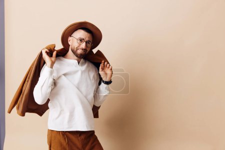 Photo for Happy man stylish young guy expression background hat background fashionable person model portrait lifestyle hipster casual handsome caucasian adult beard modern man glasses gesture style - Royalty Free Image