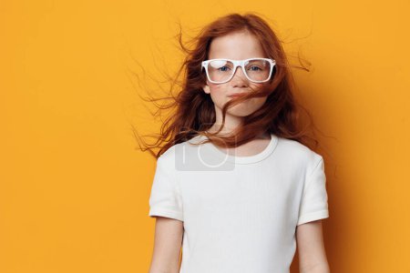 Photo for Glasses girl fashion small emotion background yellow expression childhood little face young caucasian portrait beauty lifestyle kid cute female white children pretty person - Royalty Free Image