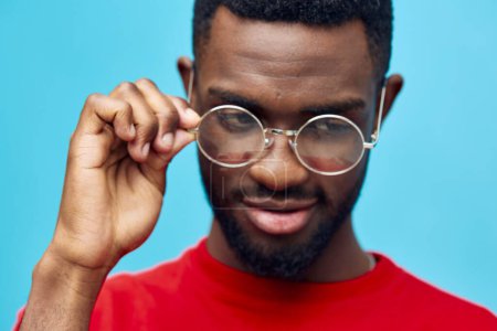Photo for American man model elegant blue portrait black isolated outfit stylish style handsome modern green glasses african copy earring male expression space fashion studio - Royalty Free Image