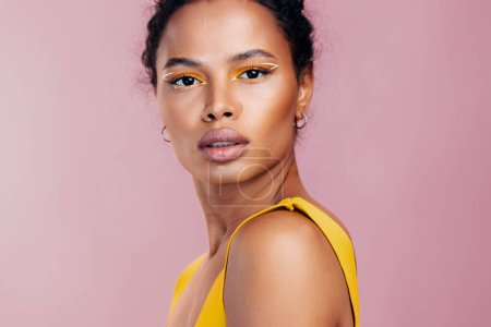 Photo for Woman smile creative beauty fashion colourful make-up cosmetology yellow model black face beautiful portrait skin studio style african cosmetic - Royalty Free Image