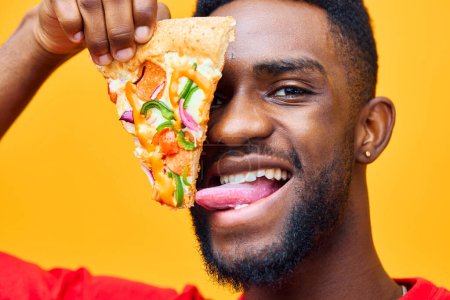Photo for American man space african dieting weight food happy afro pizza background cheerful hold eater eat fast black food smile delivery studio unhealthy copy red guy - Royalty Free Image
