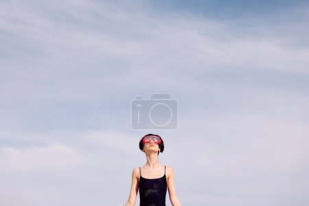 Photo for Joyful Woman Snorkeling in Red Fashion Face Mask: A Smiling Portrait in a Tropical Beach Setting - Royalty Free Image