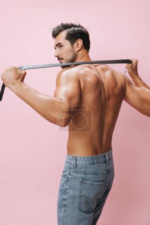 Photo for Body man beauty muscular sport background lifestyle fitness belt boy fashion pink bodybuilder muscle sexy holiday shirtless model bicep strong torso naked fit jeans - Royalty Free Image