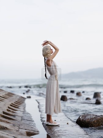 Photo for Summer Beauty: Young Woman Enjoying a Relaxing Day at the Beach, Feeling the Freedom and Attractiveness of Natures Lure. - Royalty Free Image