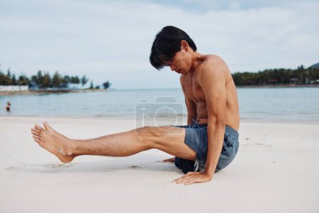 Photo for Active Asian Runner Enjoying the Beach: Muscular Man Embracing Fitness and Wellness on Sand - Royalty Free Image