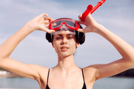 Photo for Smiling Woman in Red Snorkeling Mask: Portrait of Fashionable Vacation Lifestyle. - Royalty Free Image