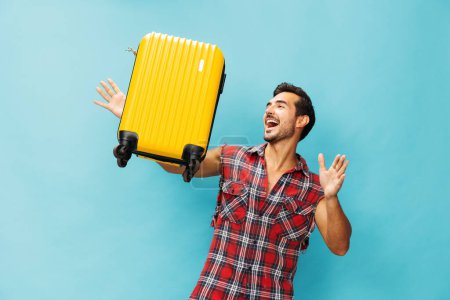 Photo for Journey man suitcase space hipster luggage trip copy lifestyle studio weekend baggage voyage vacation blue background yellow happy tour flight style ticket guy travel traveler holiday - Royalty Free Image