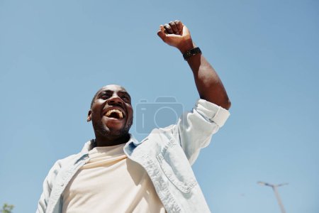 Photo for Man looking confident person african fashion portrait lifestyle american adult expression cheerful male handsome black summer young happy guy - Royalty Free Image