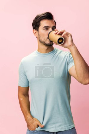Photo for Man mug insomnia smile isolated energy drink fashion copy coffee sleep tea hipster background studio happy model student cup pink paper space t-shirt hot - Royalty Free Image