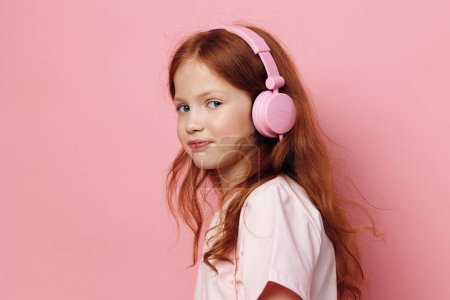 Photo for Little audio sound beauty headphone cute young kid caucasian music portrait person expression face female technology listen childhood song children small girl earphones - Royalty Free Image