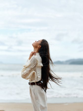 Photo for Serene Summer Beauty: A Young Womans Blissful Escape to the Tranquil Shores - Royalty Free Image