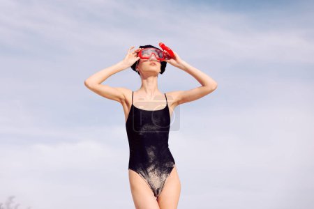 Photo for Joyful Woman Snorkeling: Red Fashion Mask, Smiling Portrait in Swimsuit, Vacation Lifestyle on Tropical Beach - Royalty Free Image