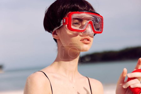 Photo for Cheerful Woman Smiling in Red Swimsuit, Snorkeling Mask, and Tropical Fashion Portrait - Royalty Free Image