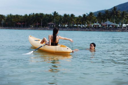 Photo for Kayaking Bliss: A Carefree Couples Adventurous Getaway on a Beautiful Asian Tropical Lake - Royalty Free Image