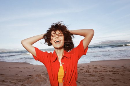Photo for Freedom and Joy: Smiling Woman Embracing Summer Fun at the Beach - Royalty Free Image