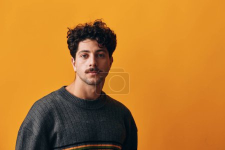 Photo for Hispanic man trendy emotion fashion smile student yellow happy person head isolated sweater portrait orange guy handsome background winter modern white gesture thoughtful - Royalty Free Image