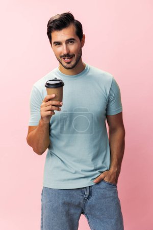 Photo for Man to insomnia drink isolated t-shirt paper hot pink space coffee energy fashion mug sleep model smile student copy studio cup happy background go hipster tea - Royalty Free Image