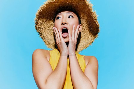 Photo for Lifestyle woman lady pretty expression emotion hand yellow beauty smile portrait fashion fun happy female trendy mouth summer swimsuit surprised amazed asian hat - Royalty Free Image
