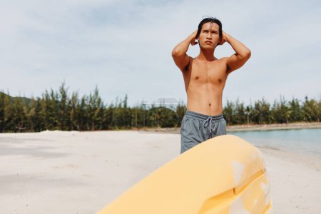 Photo for Kayak Man in Summer: Active, Happy Asian Tourist Enjoying Kayaking Adventure on Tropical Beach. - Royalty Free Image