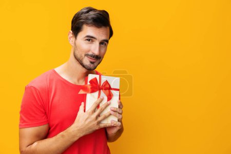 Photo for Man gift holiday gift space celebrate celebration box christmas box studio valentine copy model give sale surprise present guy holding happy birthday male - Royalty Free Image