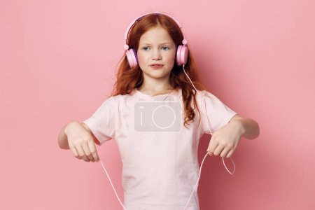Photo for Cute style listen wireless modern enjoy little child kid sound earphones song technology audio childhood small stereo headphones girl musical entertainment young - Royalty Free Image