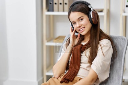 Photo for Phone app smartphone girl trendy smile music earphones headset teenage lifestyle happy pretty cellphone relax listen online chair smart meditation - Royalty Free Image