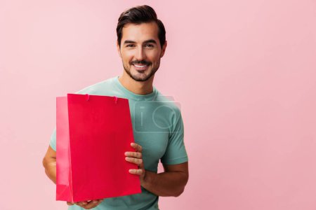 Photo for Sale man isolated women shopper present store buy happy surprise shop gift purchase bag discount lifestyle pink holiday fashion client package - Royalty Free Image