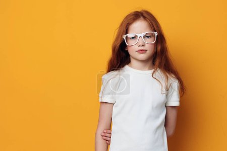 Photo for Little person female education portrait expression beauty caucasian background school childhood children kid young face girl cute glasses emotion pretty - Royalty Free Image