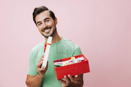 Photo for Man happy give party surprise valentine fashion studio model copy male present holding celebrate christmas space gift gift birthday box sale box guy holiday celebration - Royalty Free Image