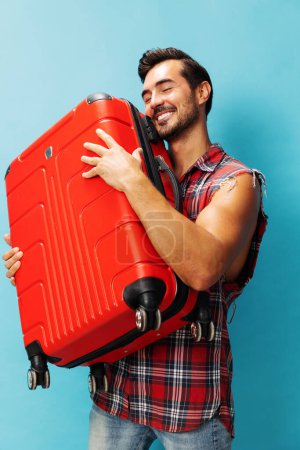 Photo for Man holiday baggage hipster red background ticket copy style space trip vacation luggage lifestyle happy guy voyage traveler flight tour journey suitcase weekend travel studio - Royalty Free Image