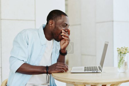 Photo for Man portrait table business person african male online computer adult happy businessman smile sitting black working lifestyle young laptop office technology american - Royalty Free Image