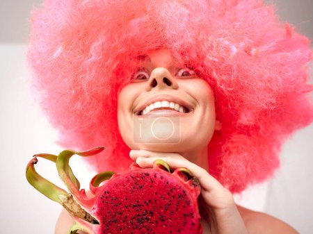 Woman with Pink Wig Holding Watermelon on White Background for Vibrant Summer Concept Photography