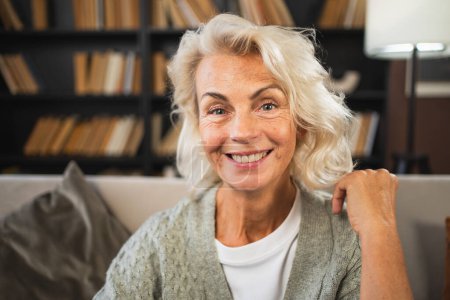 Portrait of confident stylish European middle aged senior woman. Older mature 60s lady smiling at home. Happy attractive senior female looking camera close up face headshot portrait. Happy people